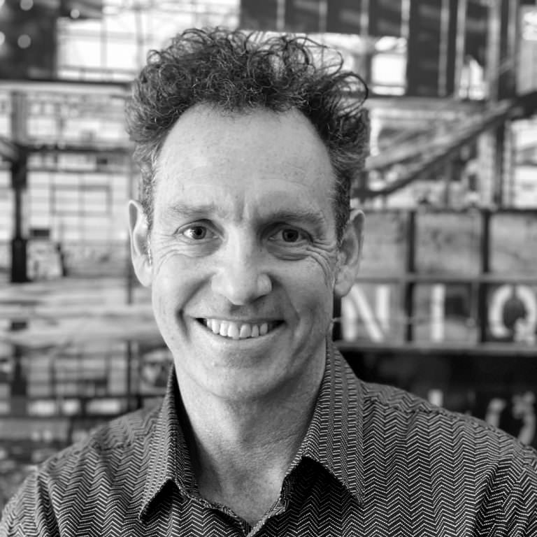 Black and white photo of Director, Neil Appleton