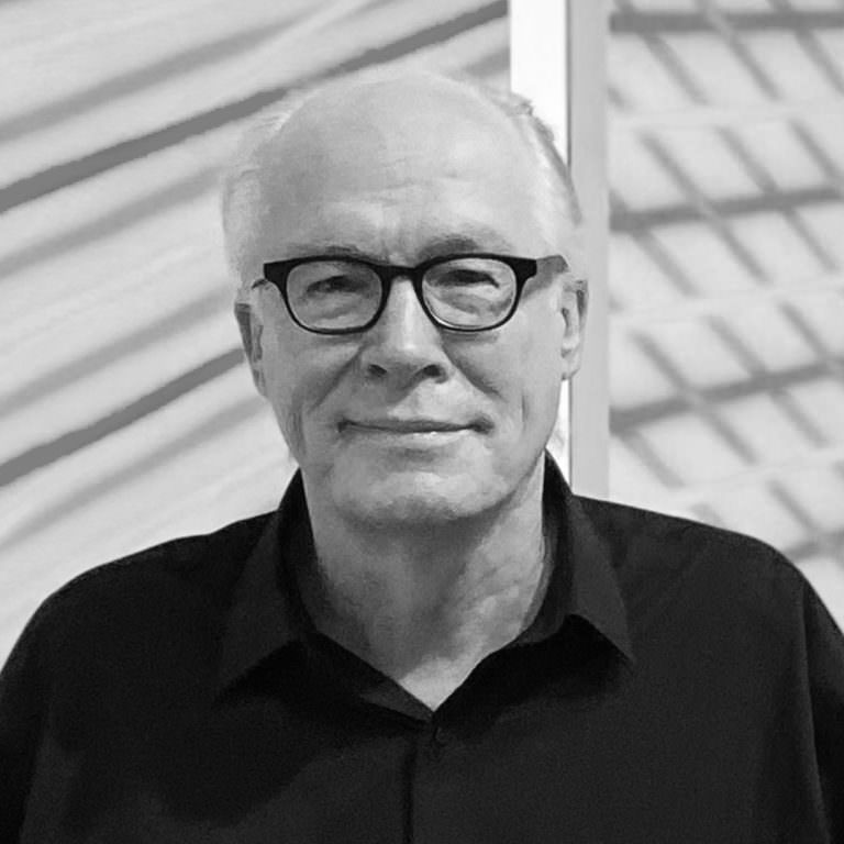 Black and white photo of Director, Corbett Lyon