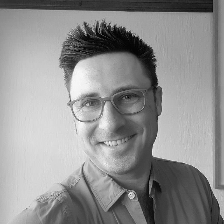 Black and white photo of Adam Pustola