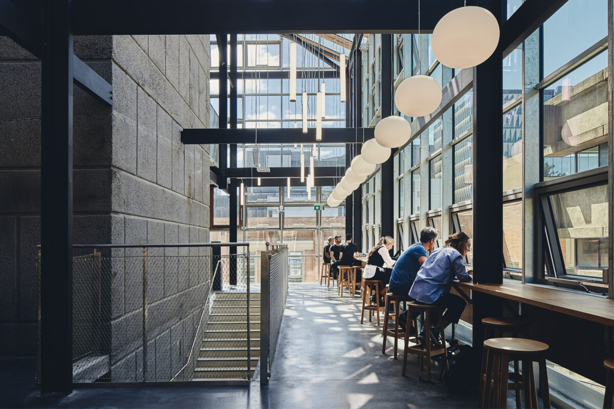 A new glass atrium is integrated into the back of the 70's Doug McDonell building